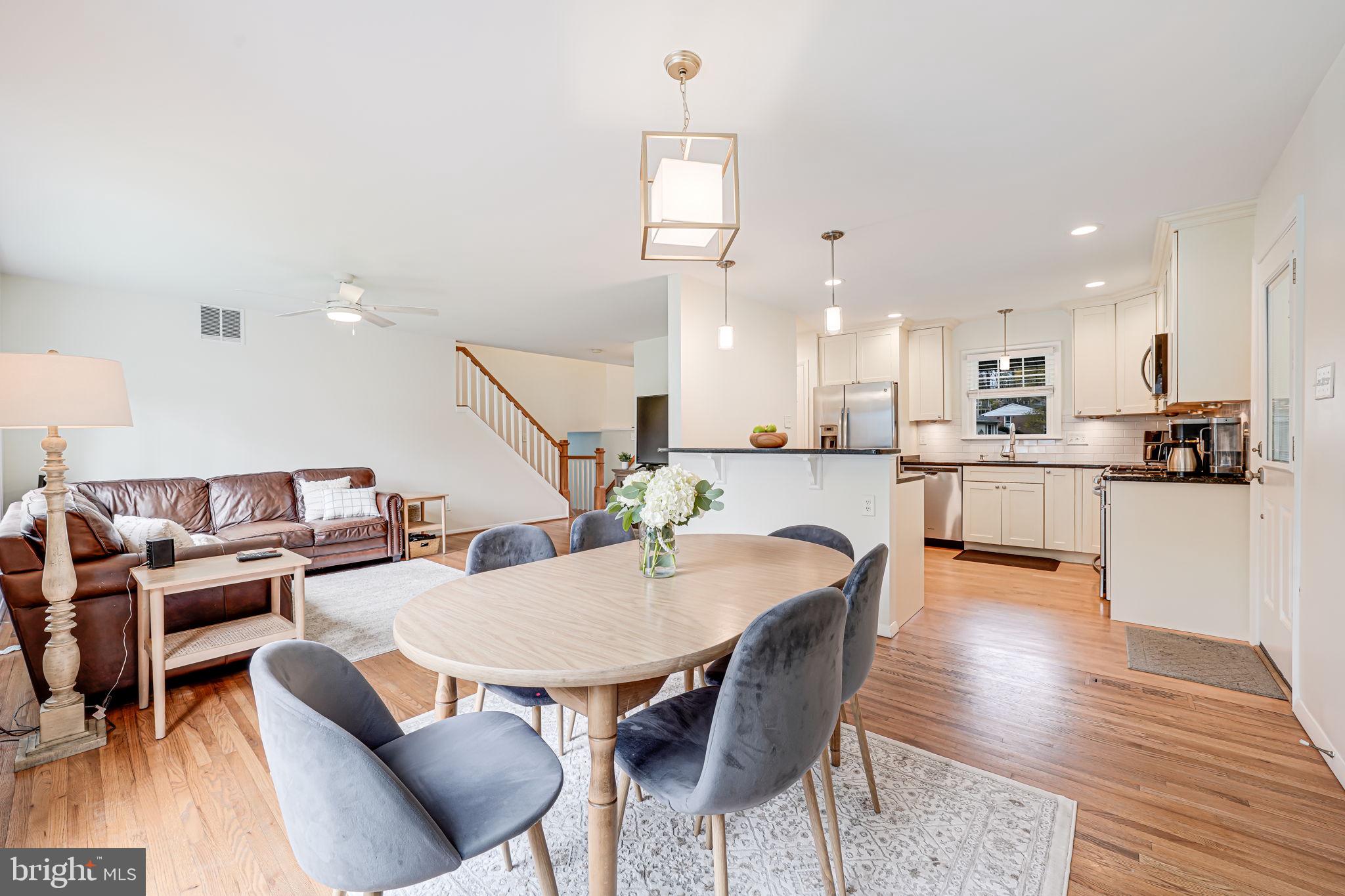 8315 Greeley Boulevard Springfield, VA 22152 - Photo 12 of 44 a dining room with furniture and wooden floor
