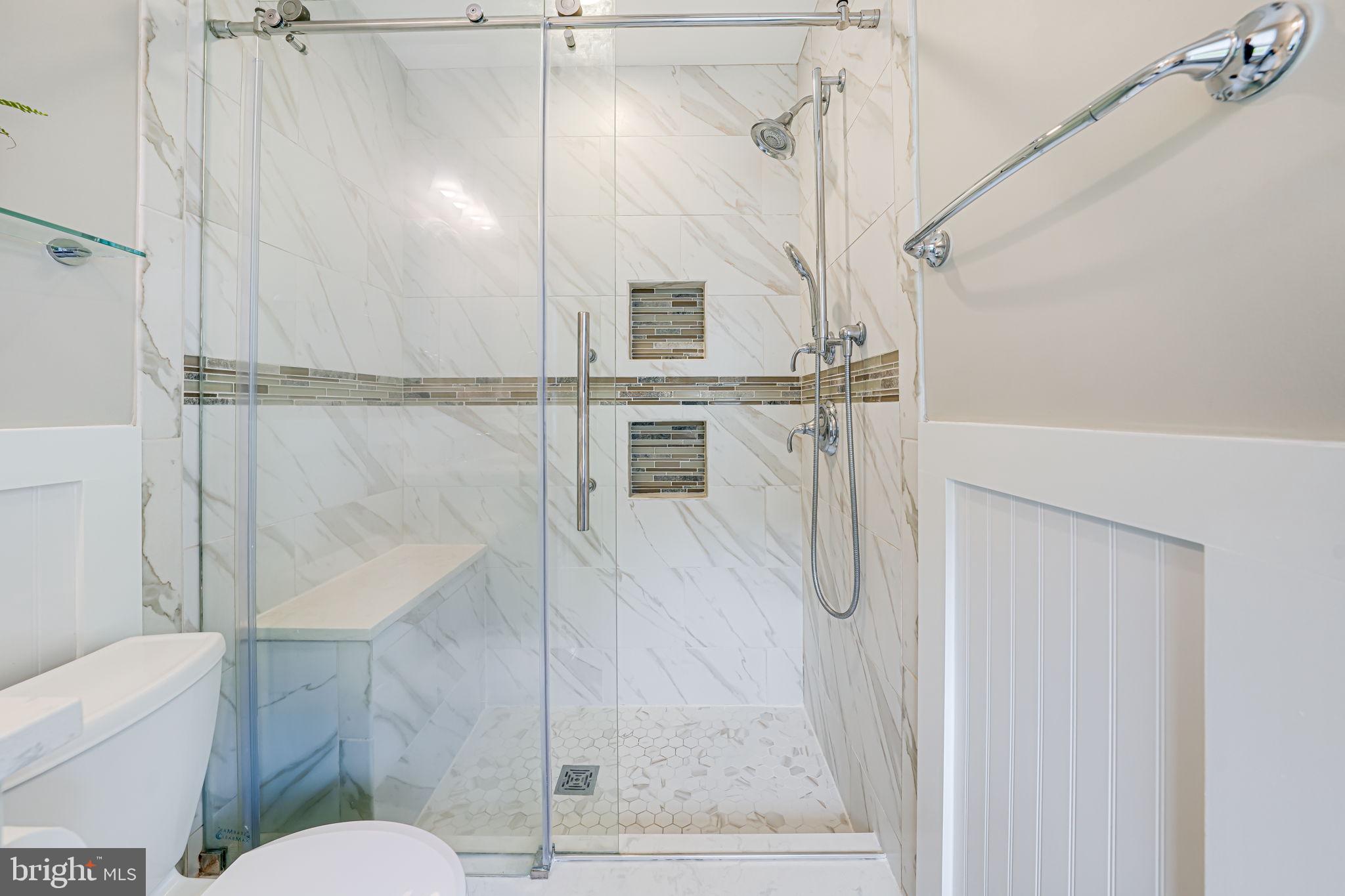 8315 Greeley Boulevard Springfield, VA 22152 - Photo 18 of 44 a bathroom with a shower and toilet