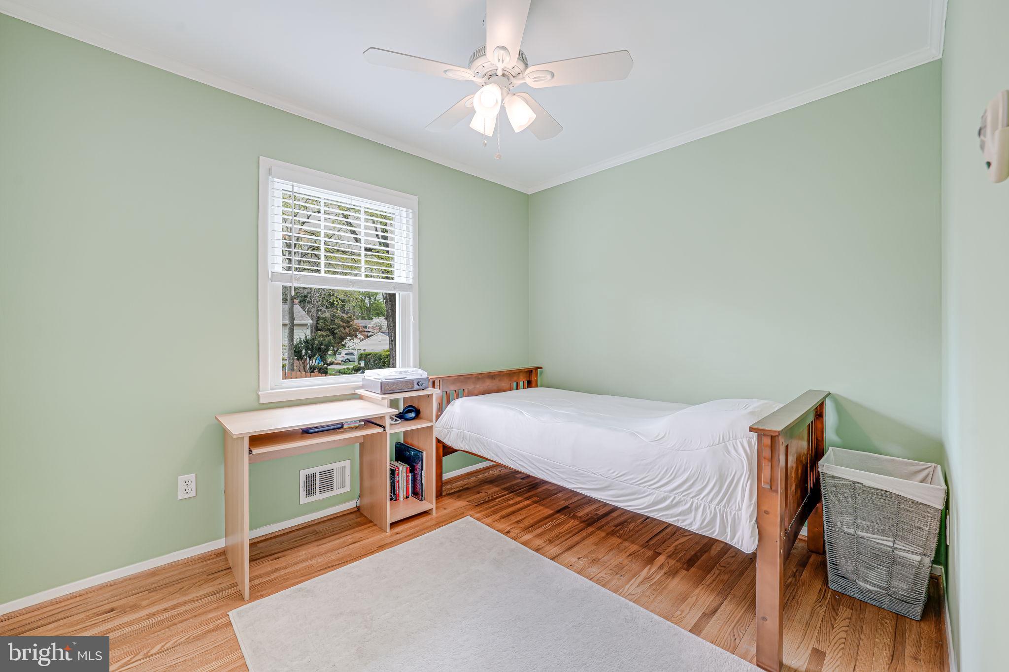 8315 Greeley Boulevard Springfield, VA 22152 - Photo 19 of 44 a bed room with a bed and a window