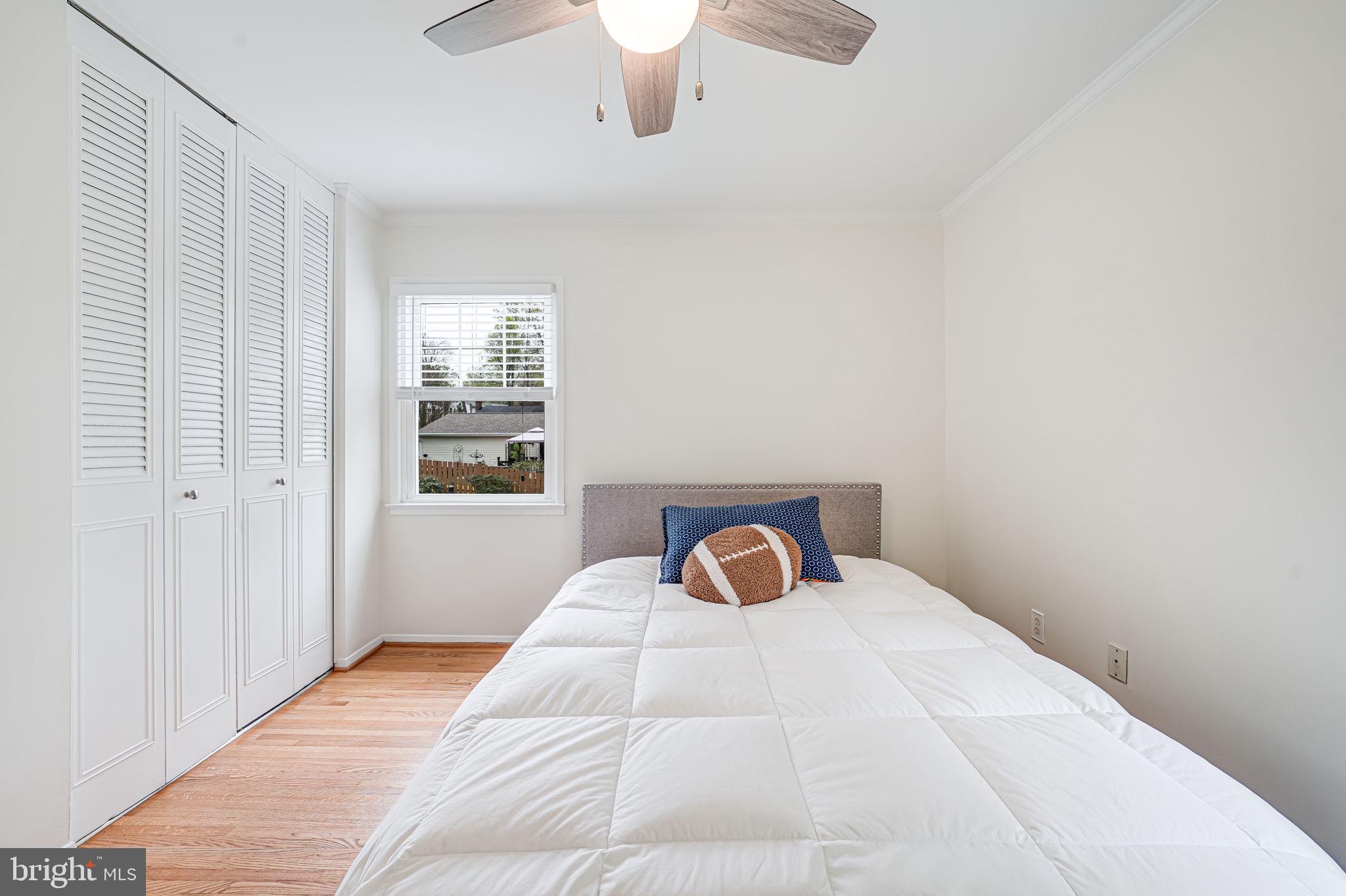 8315 Greeley Boulevard Springfield, VA 22152 - Photo 23 of 44 a bedroom with a bed and a window