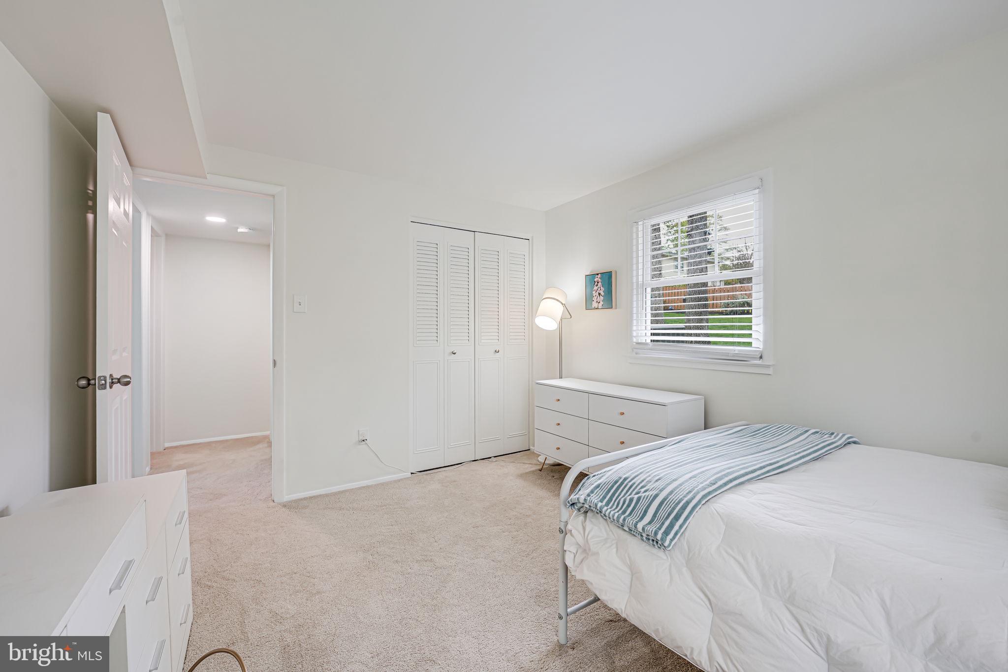 8315 Greeley Boulevard Springfield, VA 22152 - Photo 29 of 44 a bedroom with a bed and a window