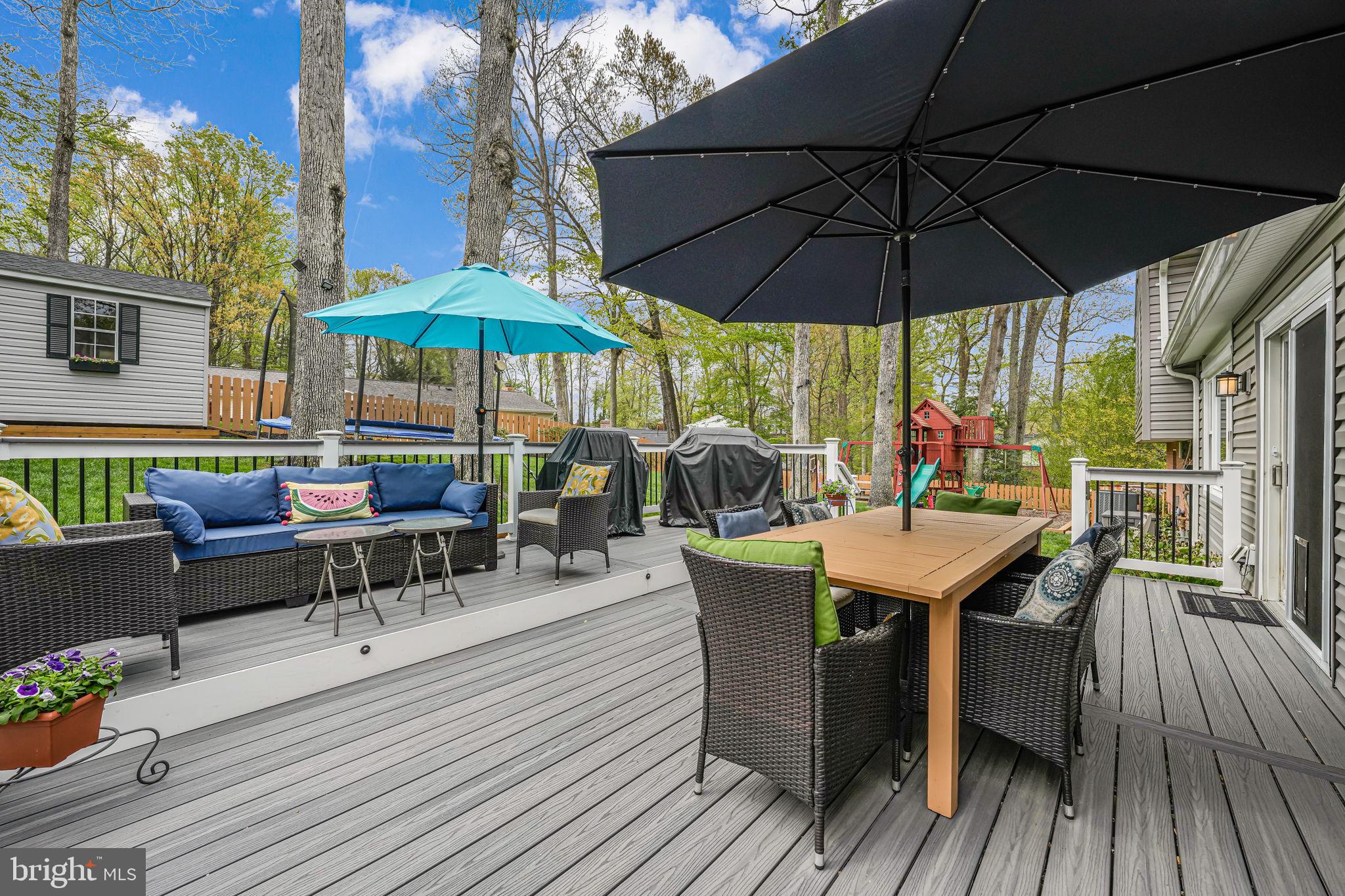 8315 Greeley Boulevard Springfield, VA 22152 - Photo 32 of 44 an outdoor space with furniture and umbrella