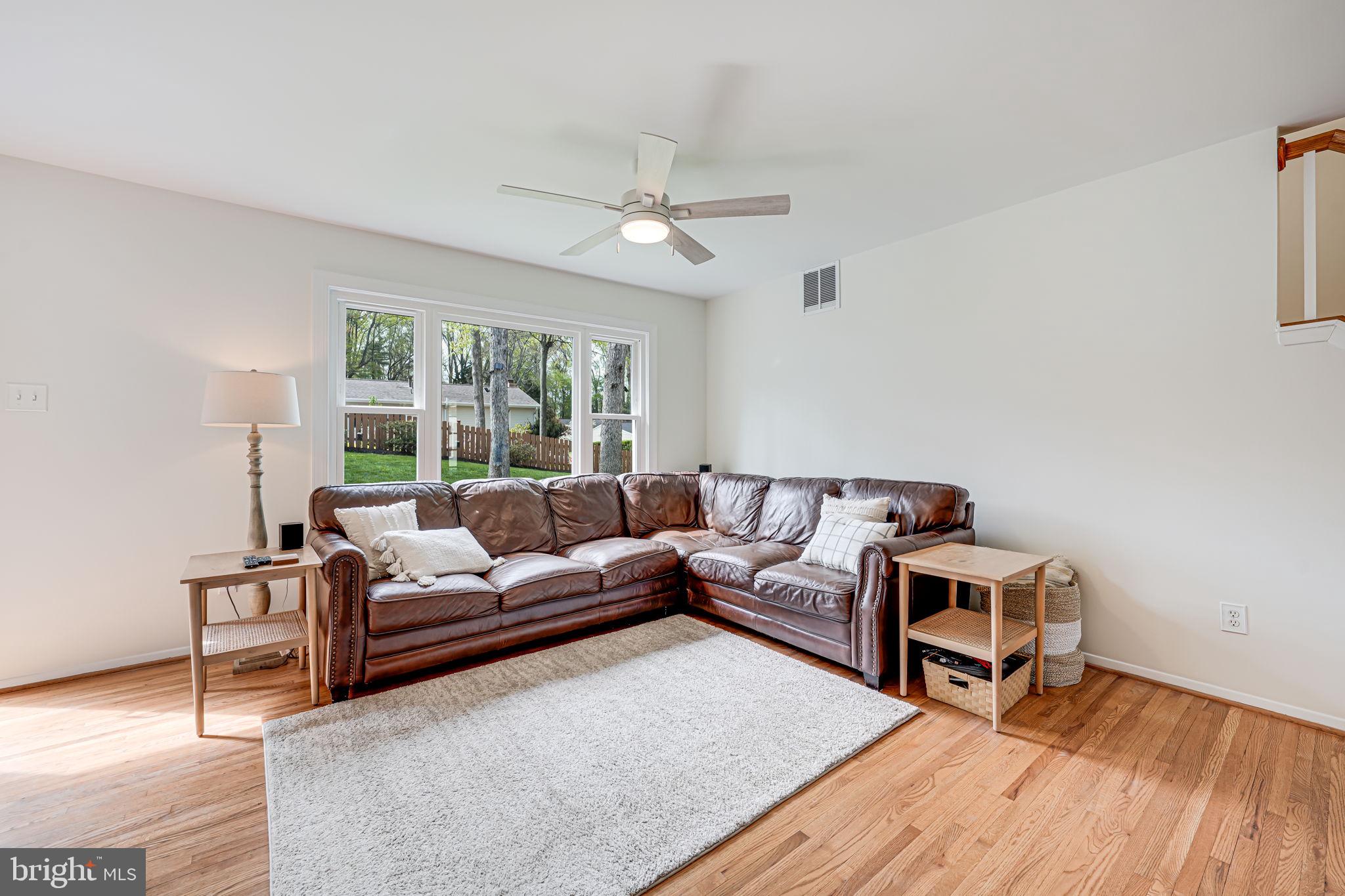 8315 Greeley Boulevard Springfield, VA 22152 - Photo 7 of 44 a living room with furniture and a wooden floor