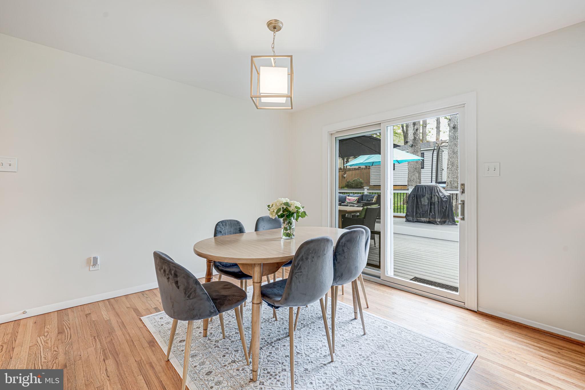 8315 Greeley Boulevard Springfield, VA 22152 - Photo 10 of 44 a view of a dining room with furniture and a window