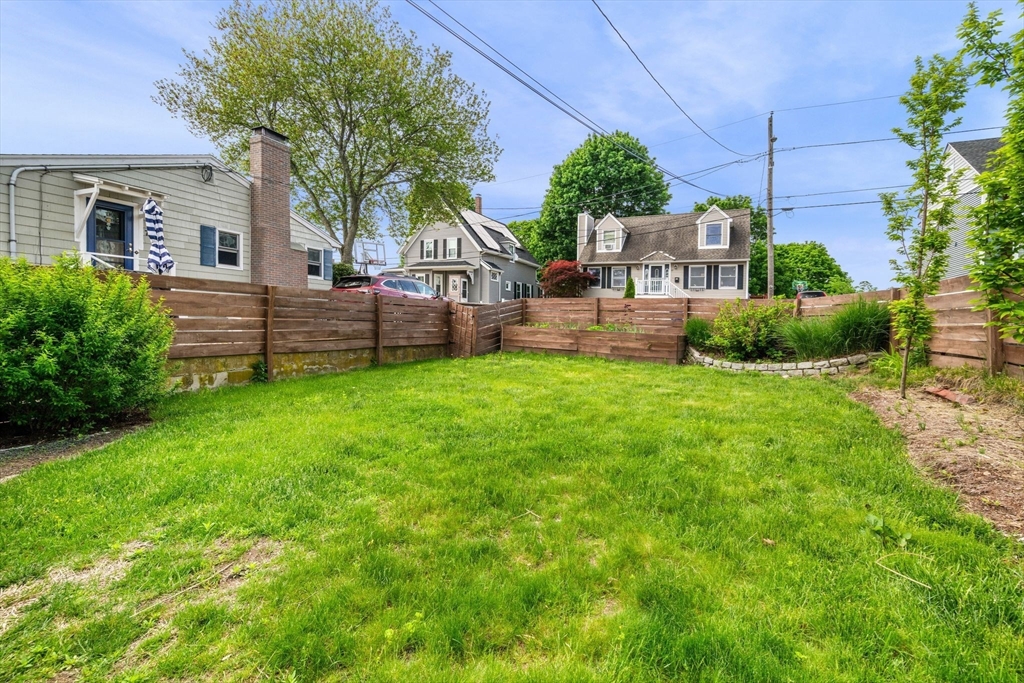 8 Baker Avenue Beverly, MA 01915 - Photo 35 of 40 a view of a house with a yard and sitting area