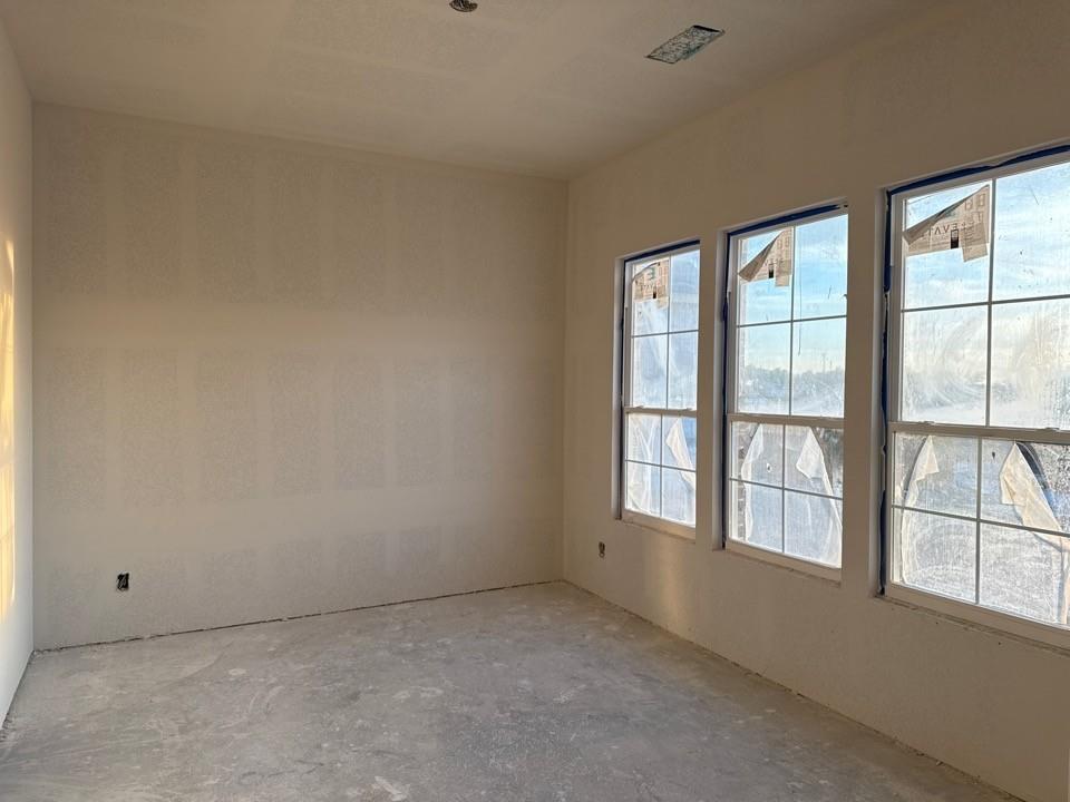 2212 Continent Court Krum, TX 76249 - Photo 7 of 15 an empty room with windows