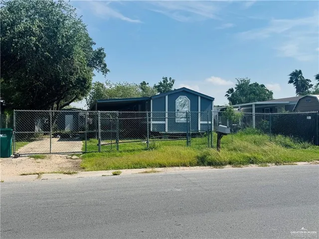 a view of house with outdoor space and swimming pool