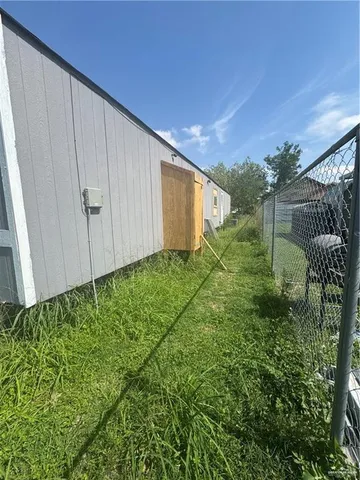 a backyard of a house with lots of green space
