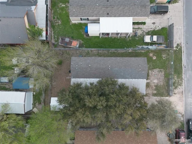 a aerial view of a house with a yard