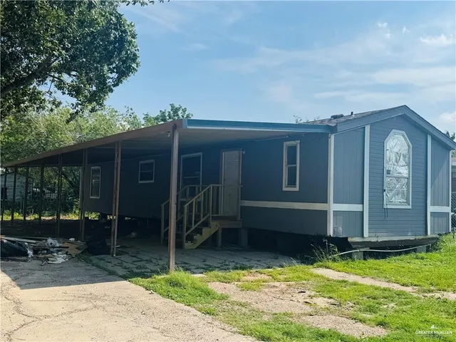 a house with a swimming pool in front of it