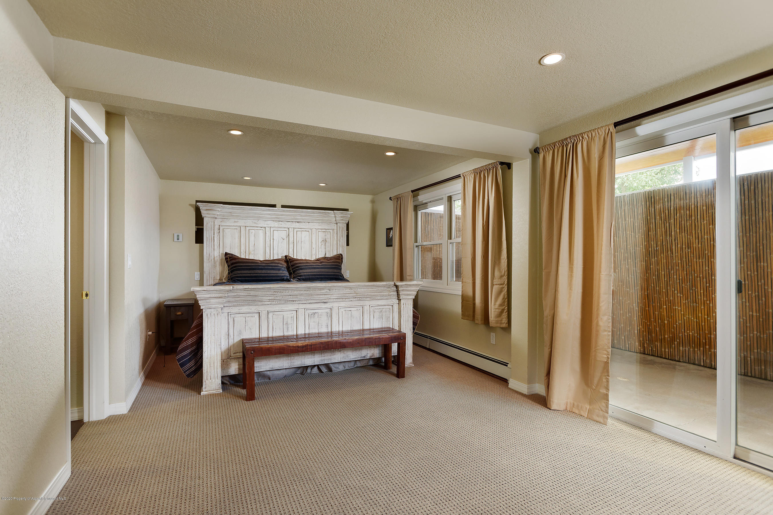 167 Fox Run Road Rifle, CO 81650 - Photo 16 of 36 a bedroom with a bed and large window