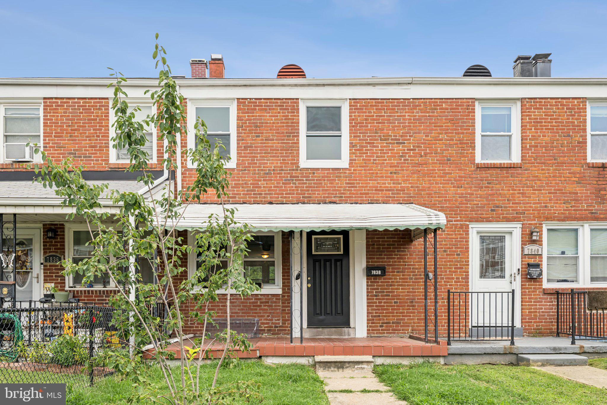 front view of a house with a yard