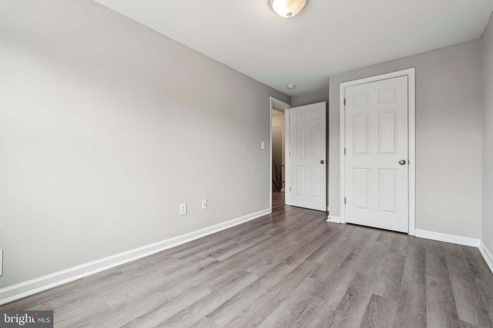 7838 St Boniface Lane Dundalk, MD 21222 - Photo 14 of 37 a view of an empty room with wooden floor