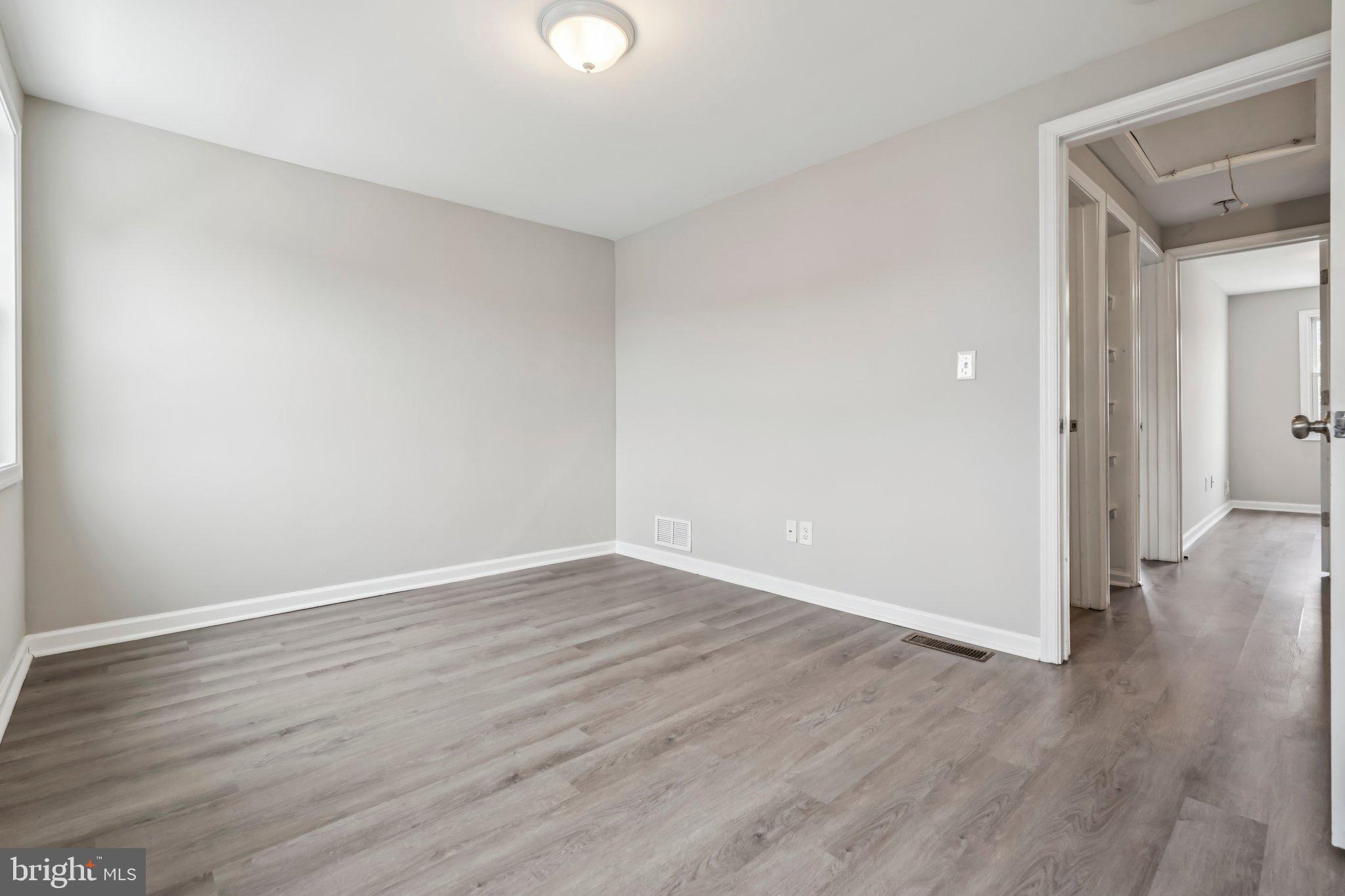 7838 St Boniface Lane Dundalk, MD 21222 - Photo 24 of 37 a view of an empty room with wooden floor