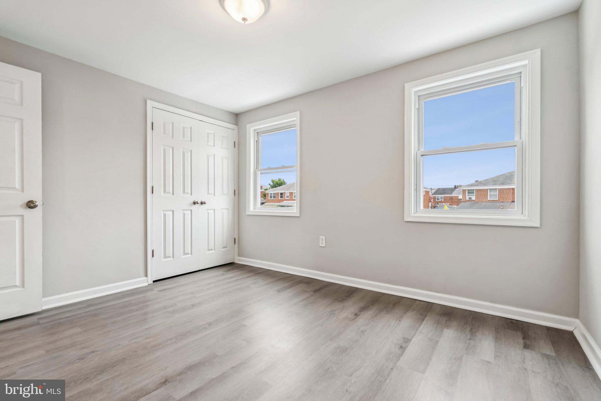 7838 St Boniface Lane Dundalk, MD 21222 - Photo 26 of 37 a view of an empty room with wooden floor and a window