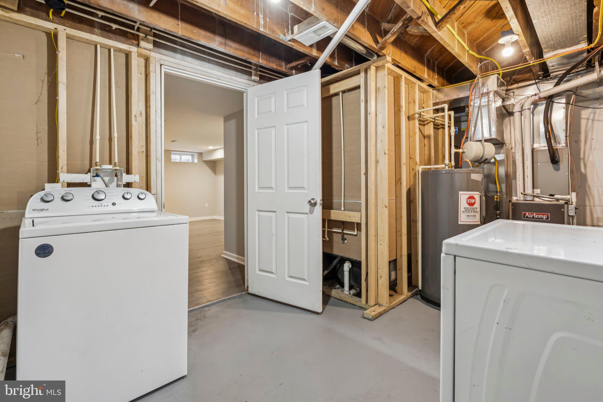 7838 St Boniface Lane Dundalk, MD 21222 - Photo 32 of 37 a utility room with dryer and washer