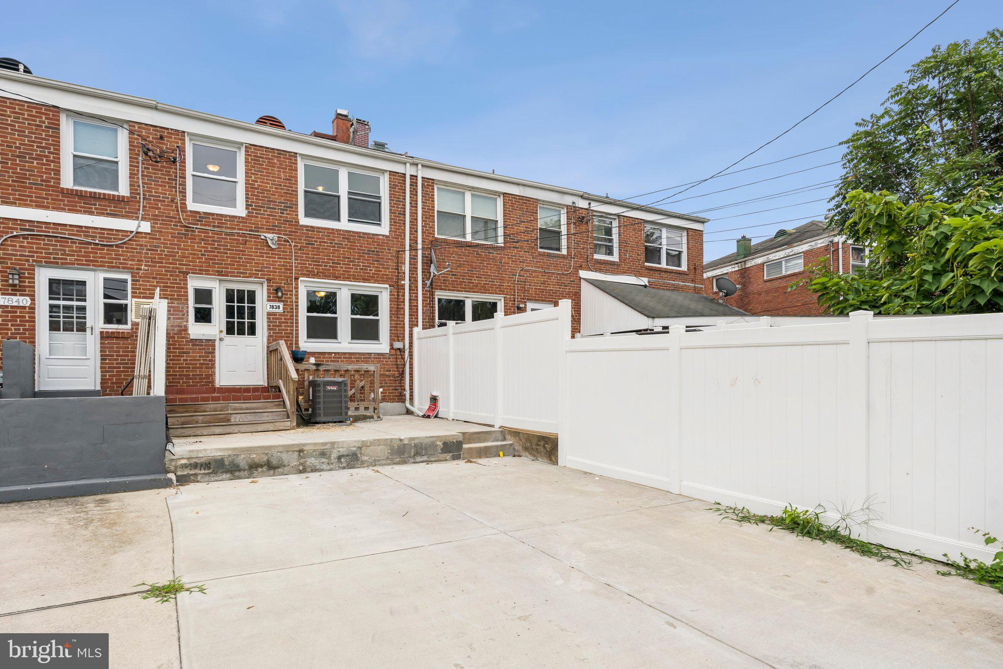 7838 St Boniface Lane Dundalk, MD 21222 - Photo 34 of 37 a front view of a house with a yard