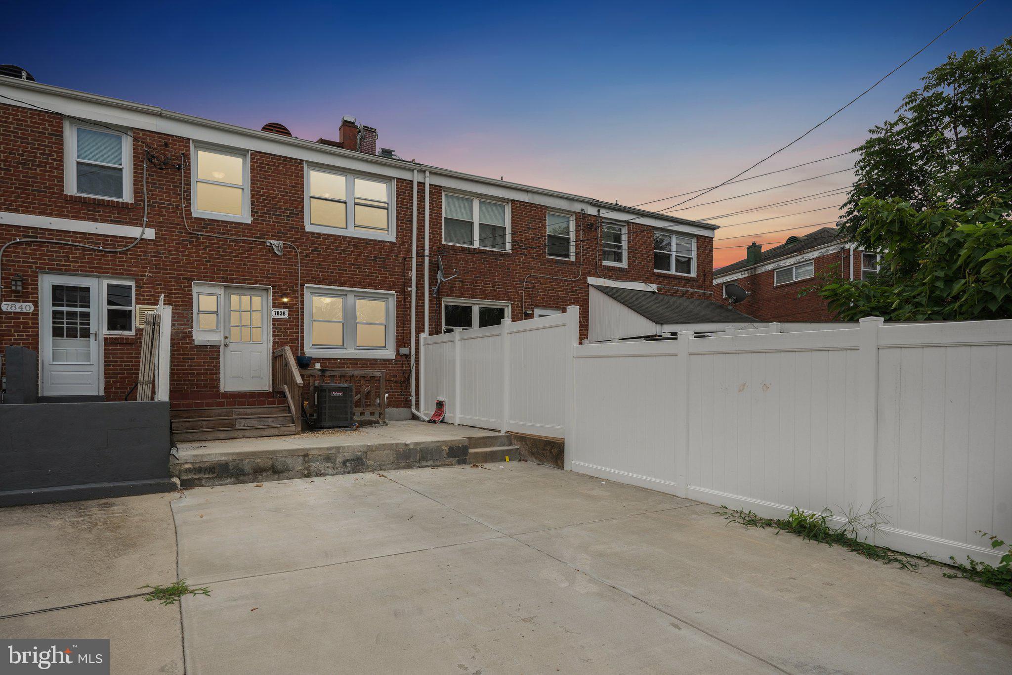 7838 St Boniface Lane Dundalk, MD 21222 - Photo 35 of 37 a front view of a house with a yard