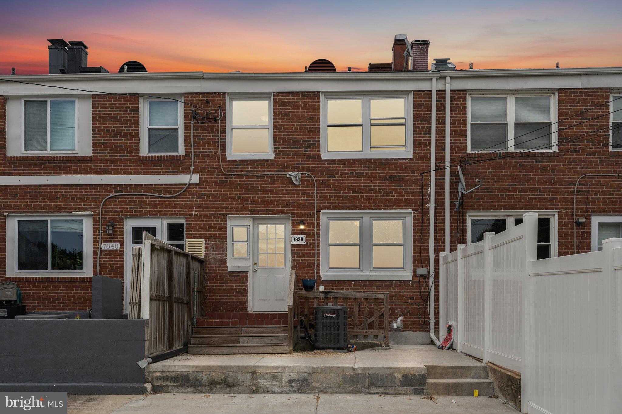7838 St Boniface Lane Dundalk, MD 21222 - Photo 36 of 37 a front view of a house with a yard