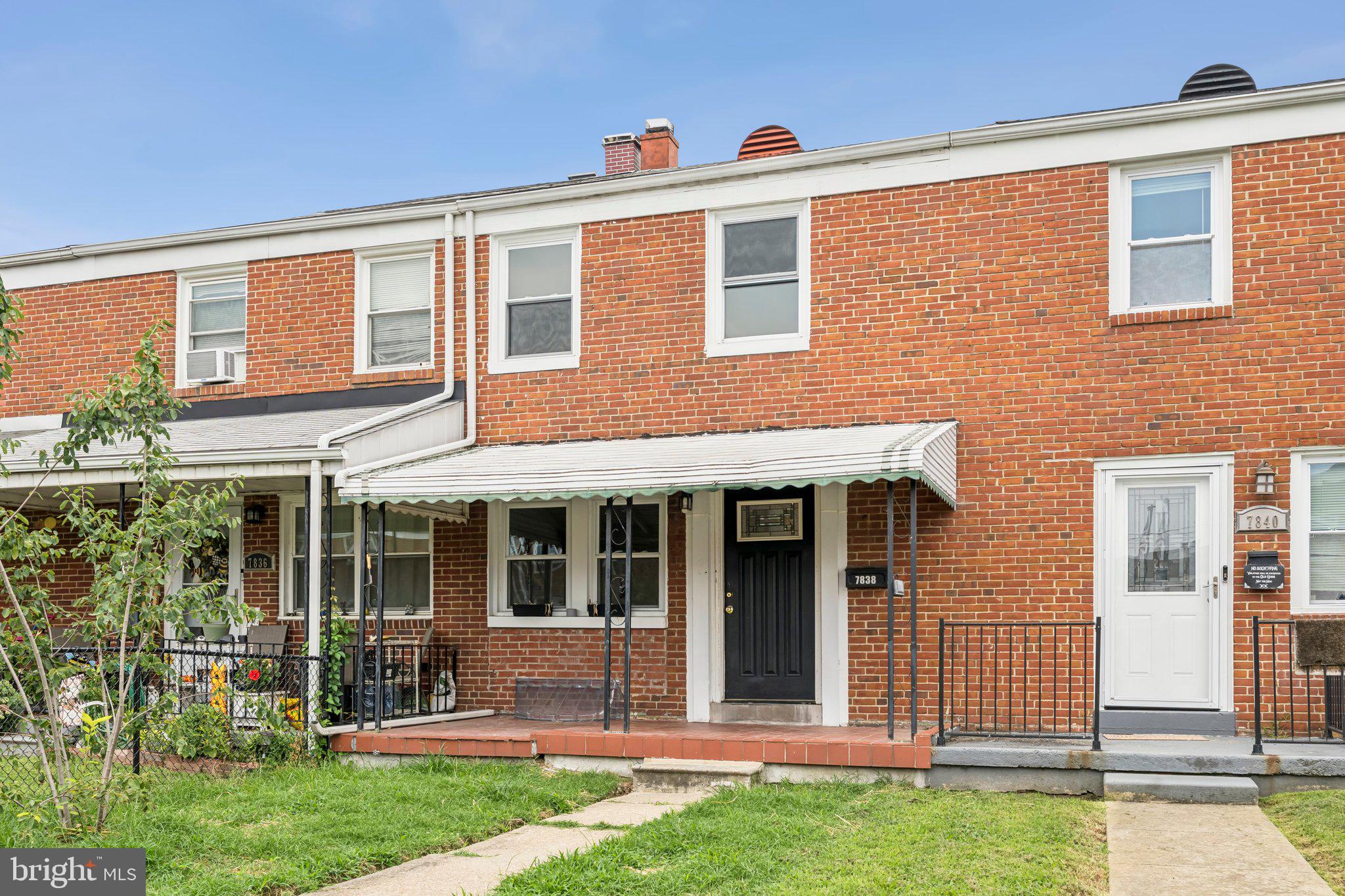 7838 St Boniface Lane Dundalk, MD 21222 - Photo 37 of 37 a front view of a house with a yard