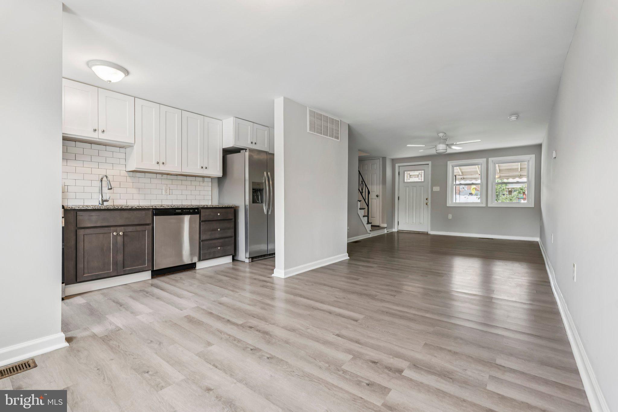 7838 St Boniface Lane Dundalk, MD 21222 - Photo 7 of 37 a view of kitchen with wooden floor and electronic appliances