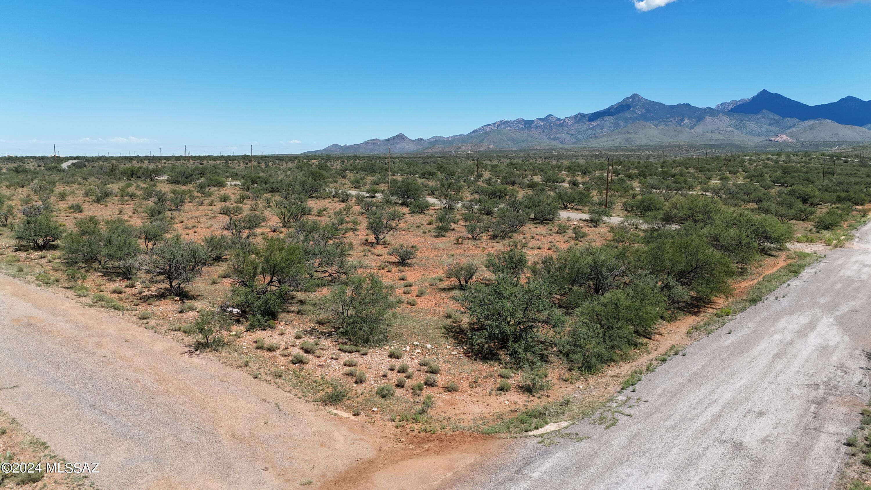 535 Via Ajo, Unit 8 Rio Rico, AZ 85648 - Photo 2 of 11 a view of an lake with a mountain in the background