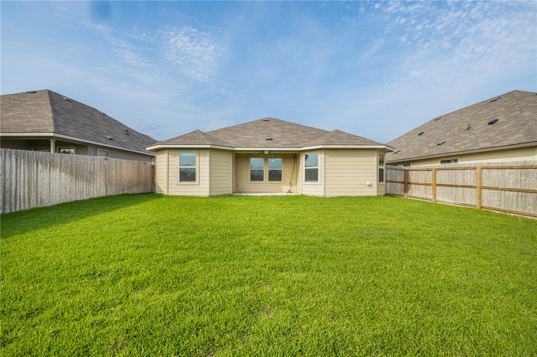2110 Chief Street Bryan, TX 77807 - Photo 13 of 16 Rear view of house featuring a patio area and a fenced backyard