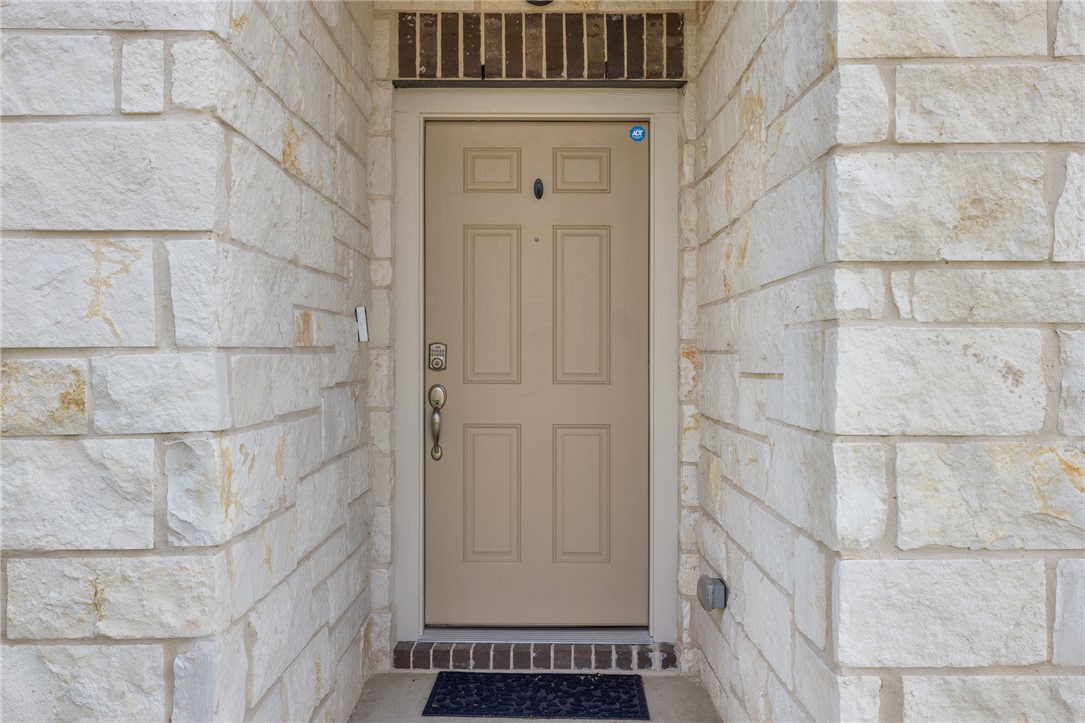 2110 Chief Street Bryan, TX 77807 - Photo 2 of 16 Doorway to property with stone siding