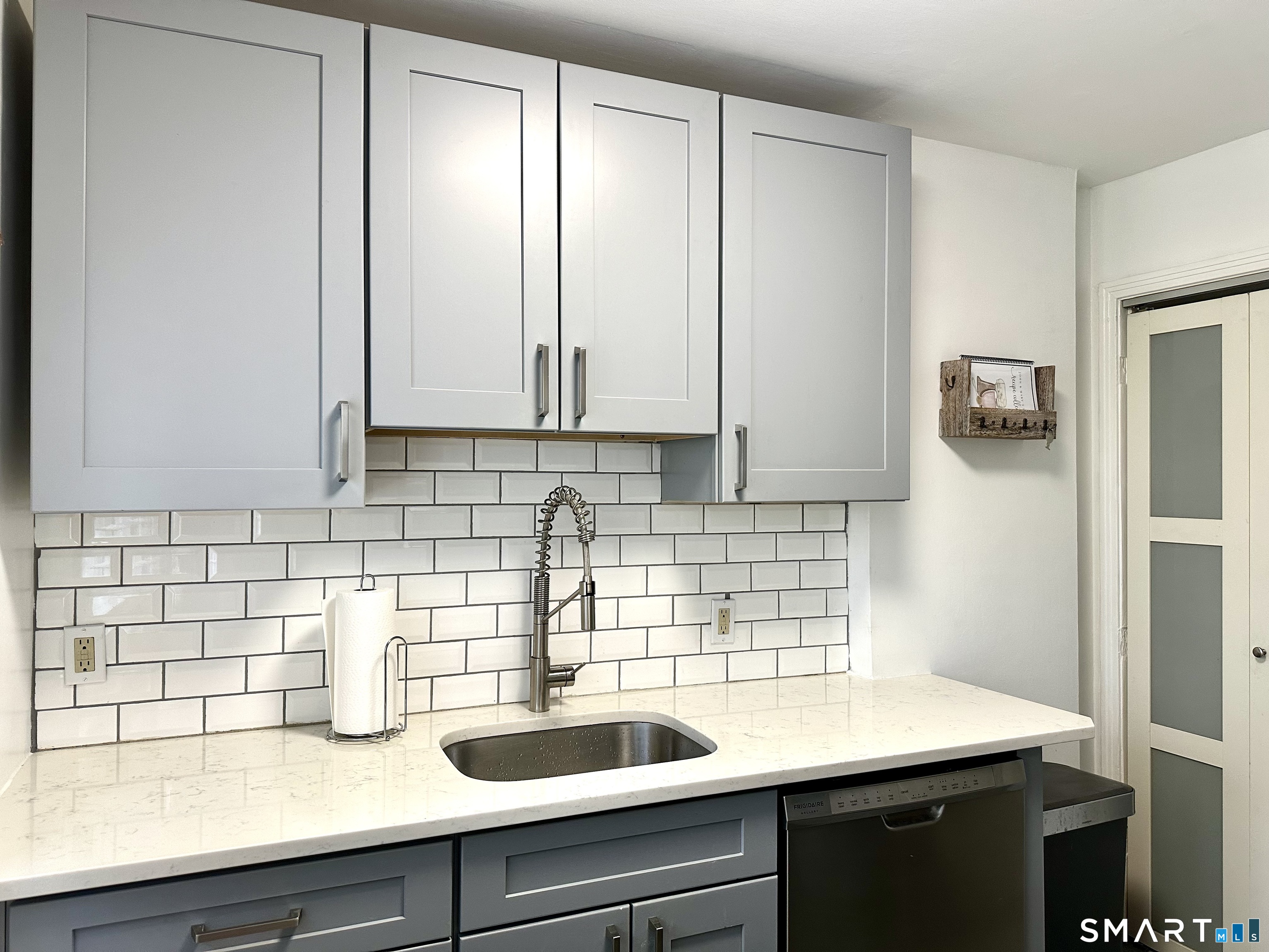 198 Sylvan Knoll Road Stamford, CT 06902 - Photo 5 of 17 a kitchen with a sink and cabinets