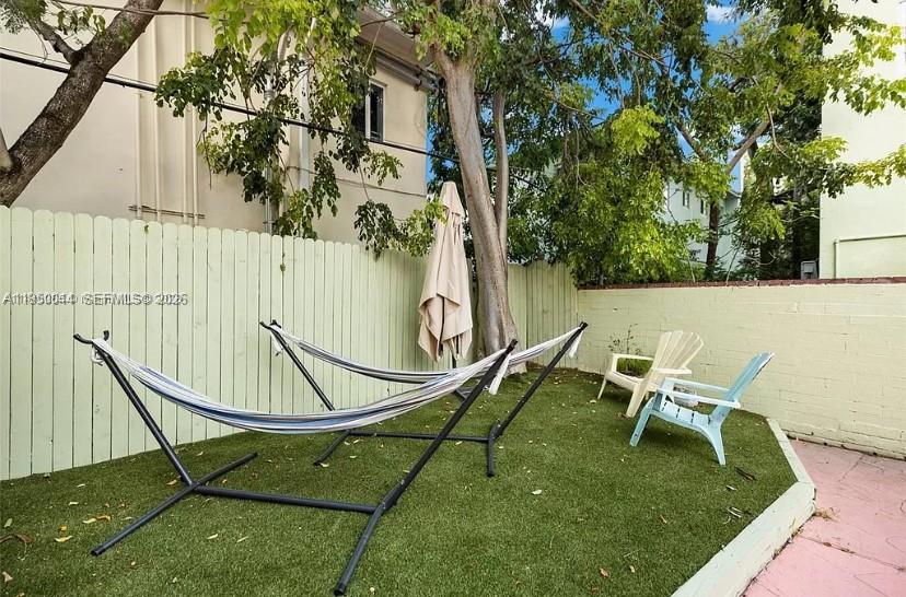 2822 Pine Tree Drive, Unit 4A Miami Beach, FL 33140 - Photo 13 of 13 a lawn chairs sitting in a backyard
