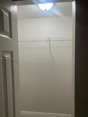 a view of small space with racks on the wall