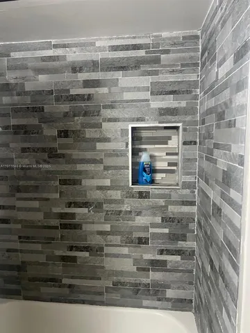 a bathroom with a granite countertop