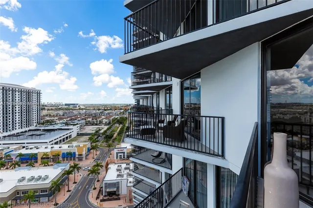 a view of a balcony with an ocean view
