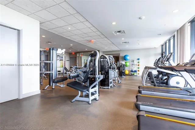 a front view of a building with a garden