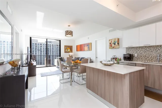 a view of kitchen and dining area with furniture