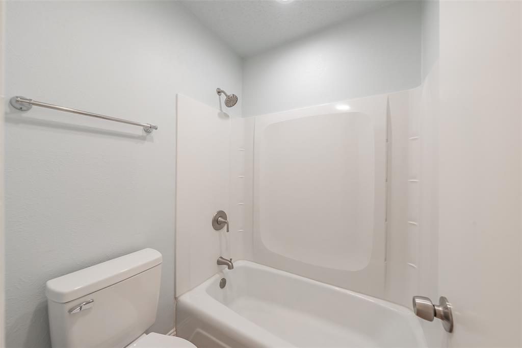 1301 Cedar Ridge Terrace Euless, TX 76039 - Photo 21 of 31 Primary bathroom with updated tub enclosure.