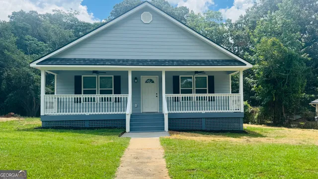 front view of a house with a yard