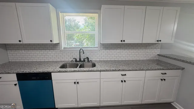 a kitchen with a stove and a microwave