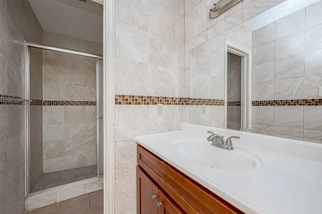 a bathroom with a sink and a shower