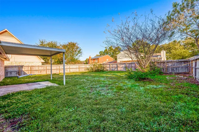 a view of a backyard with a garden