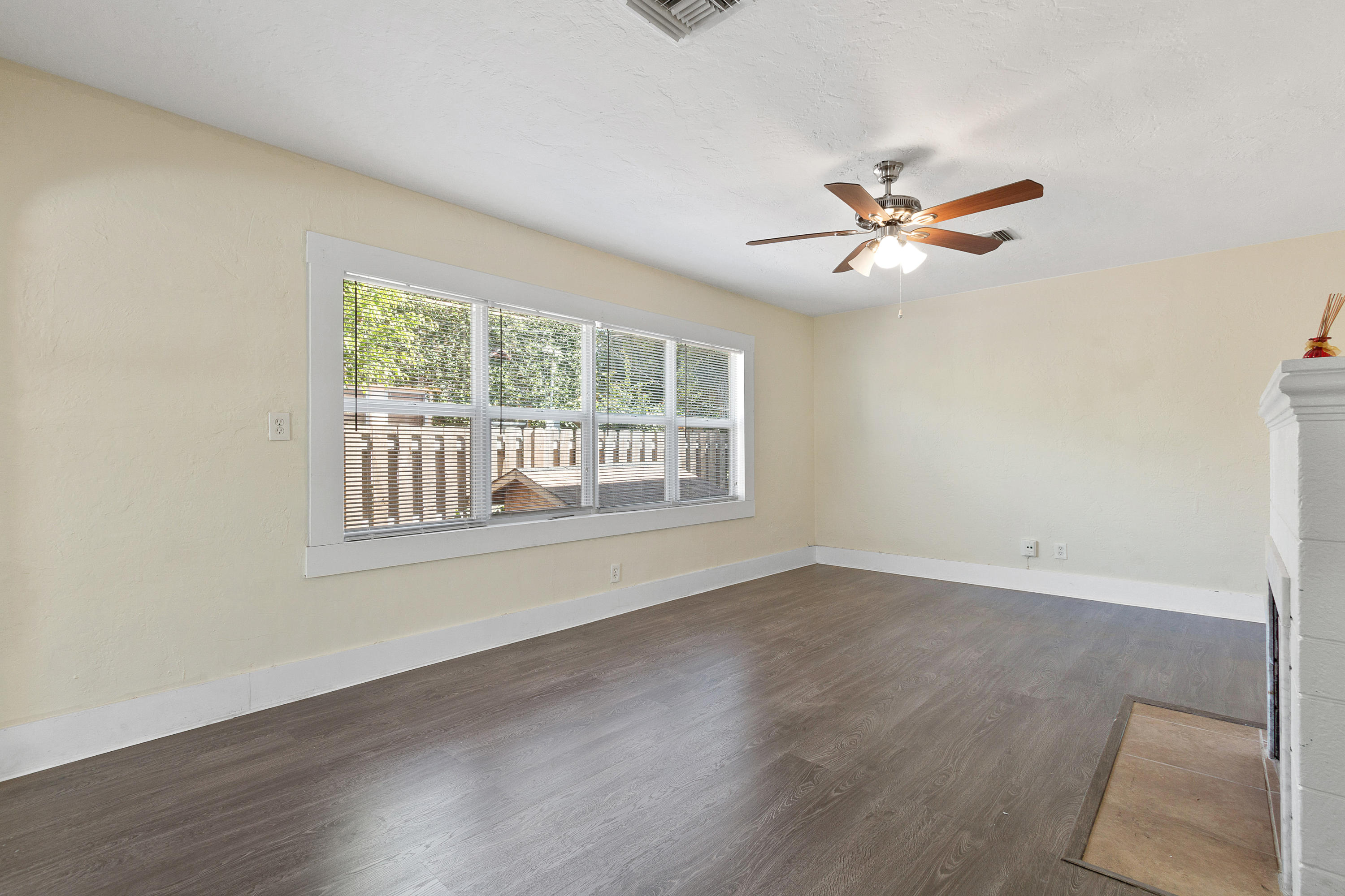 534 Hampton Road West Palm Beach, FL 33405 - Photo 8 of 29 a view of an empty room with a window and wooden floor