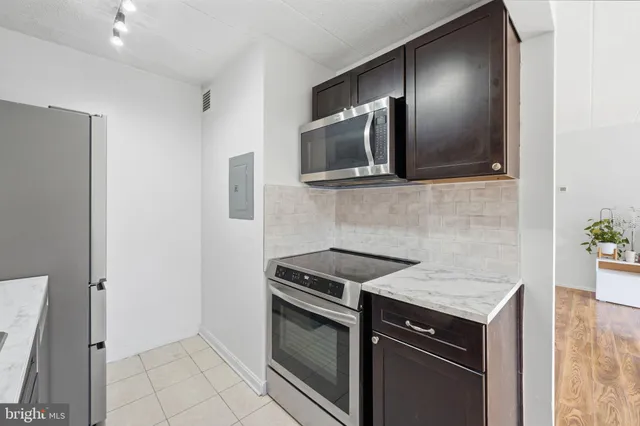 a kitchen with a stove and a microwave