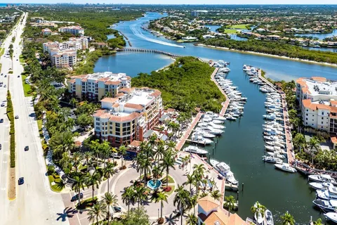 an aerial view of lake and residential houses with outdoor space