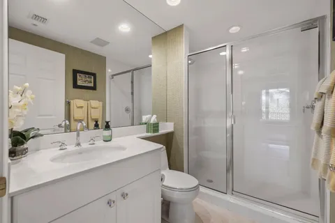 a utility room with cabinets washer and dryer