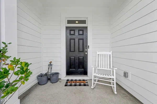 a picture of a bench in front of a door