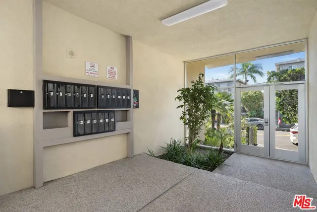 a view of a door and wooden fence