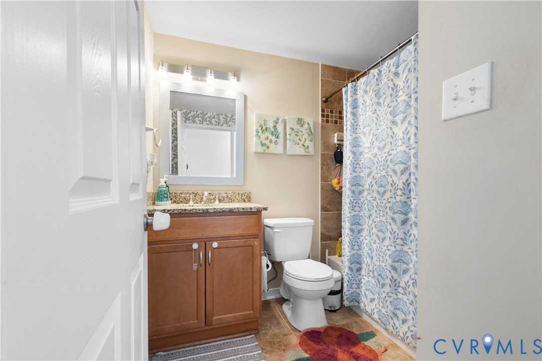 13313 Farm Crest Court Midlothian, VA 23112 - Photo 15 of 24 a bathroom with a toilet sink and shower