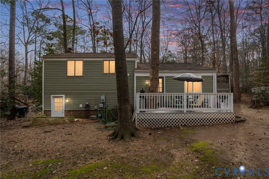 13313 Farm Crest Court Midlothian, VA 23112 - Photo 2 of 24 a view of a brick house with a small yard and large trees