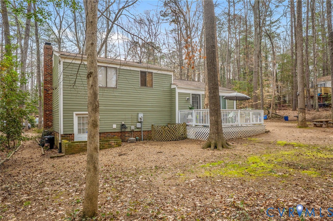 13313 Farm Crest Court Midlothian, VA 23112 - Photo 21 of 24 a view of a house with a yard covered in snow