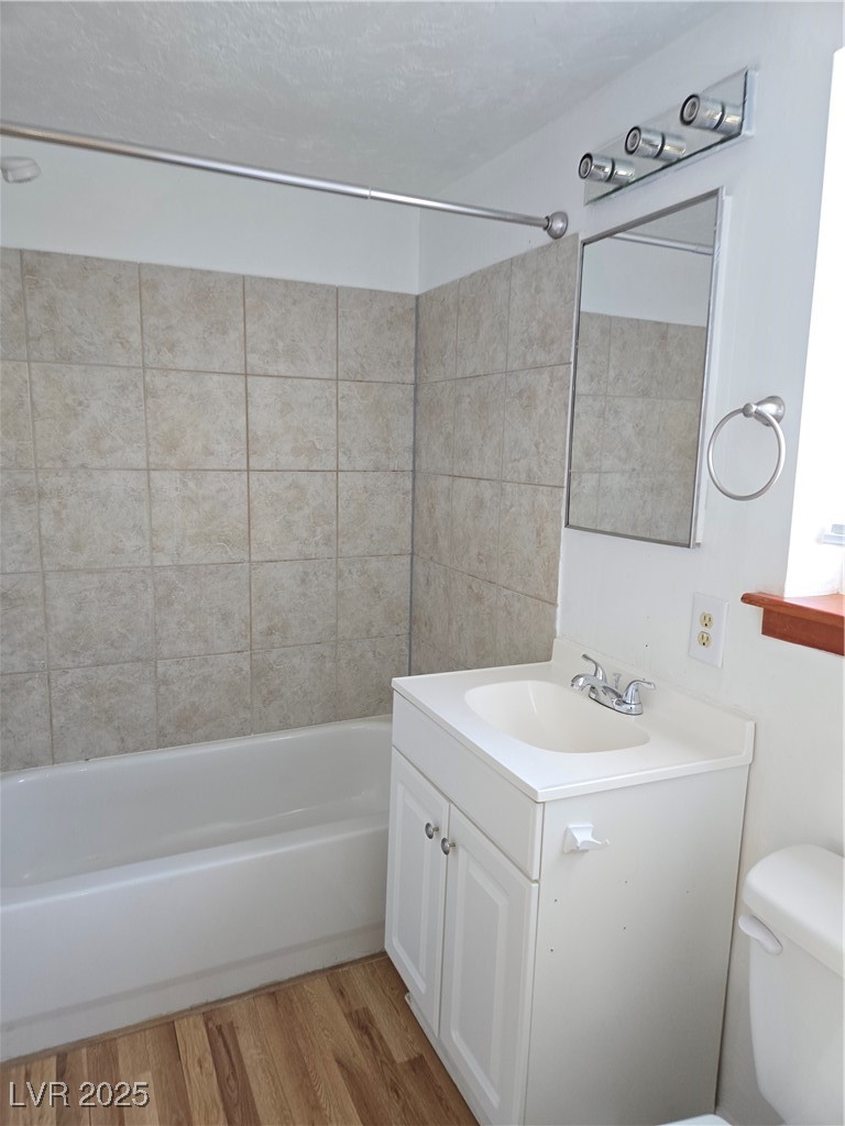 633 Nevada Way, Unit 3 Boulder City, NV 89005 - Photo 6 of 7 Bathroom with vanity, shower / bathtub combination, and light wood-style floors